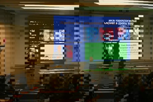 Person standing in front of a board presentation