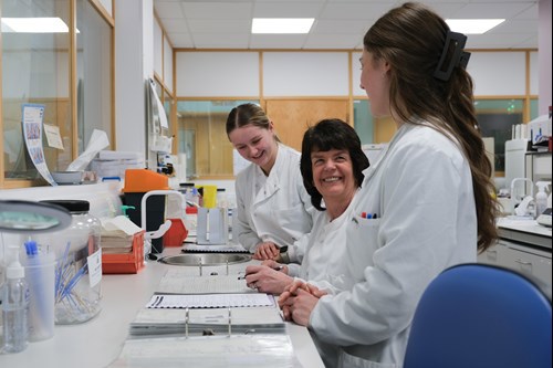Three people in a lab